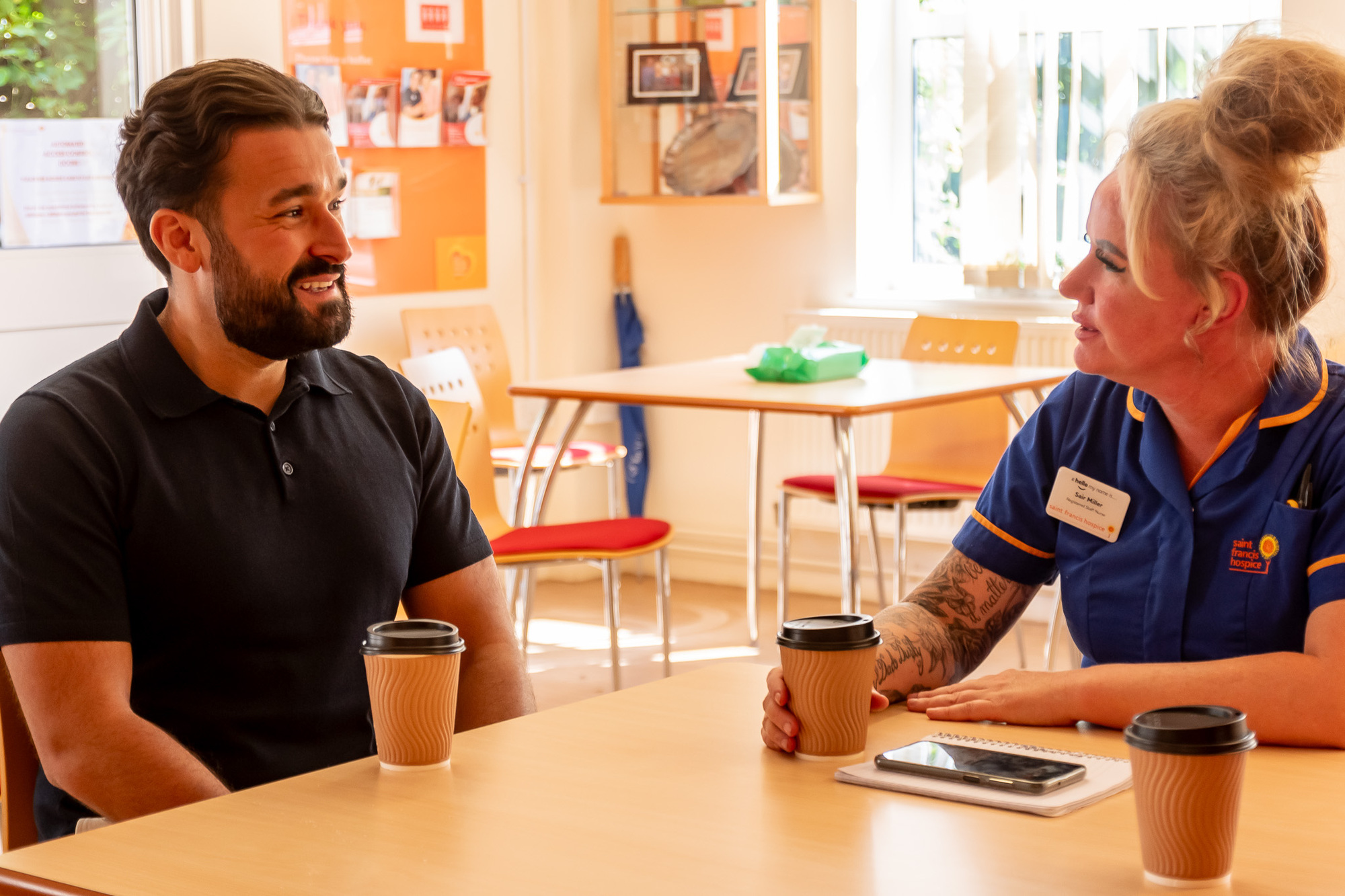 Alfie chats with nurse sairsy in the orange cafe