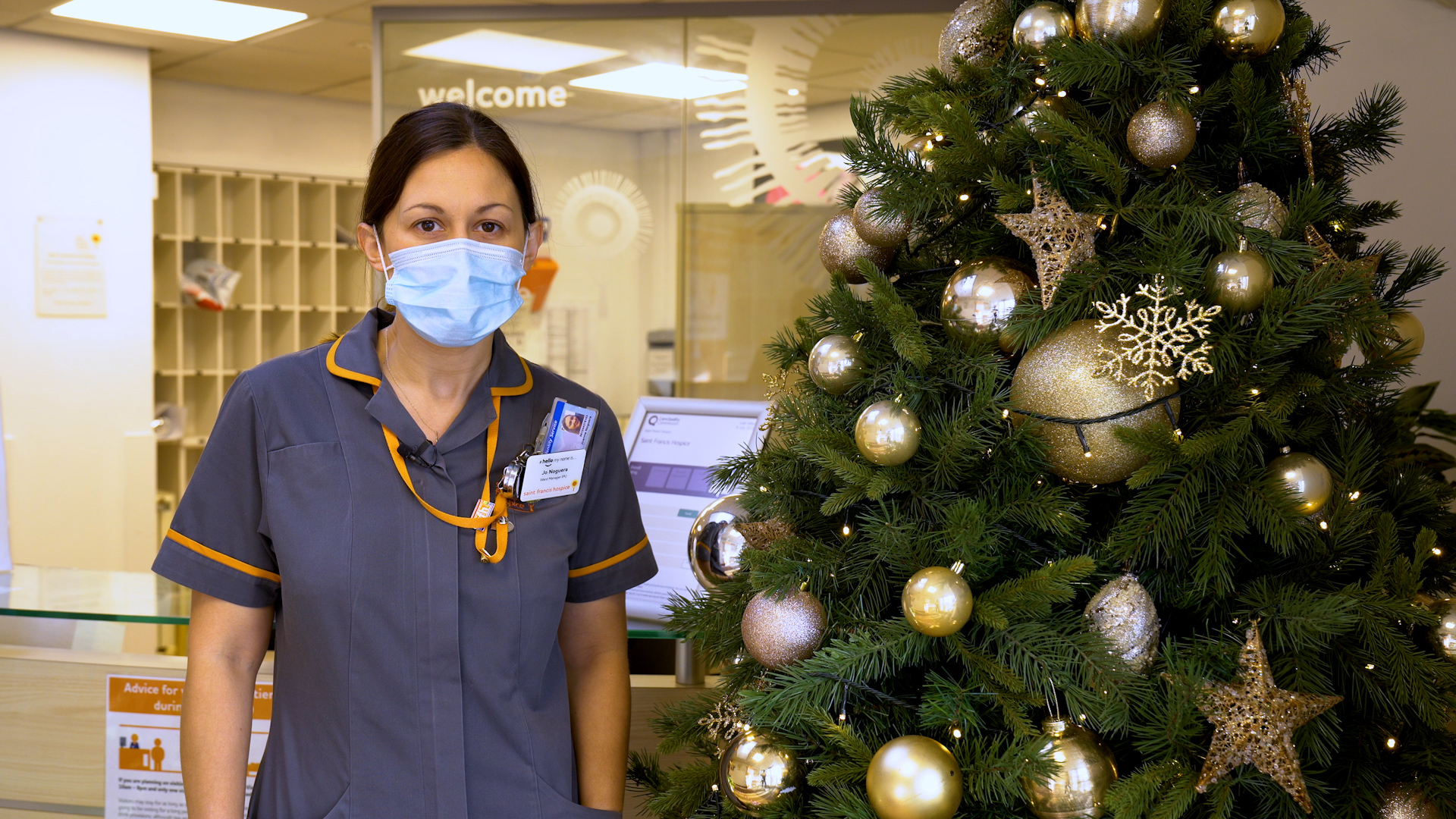 Jo Noguera by the Christmas tree